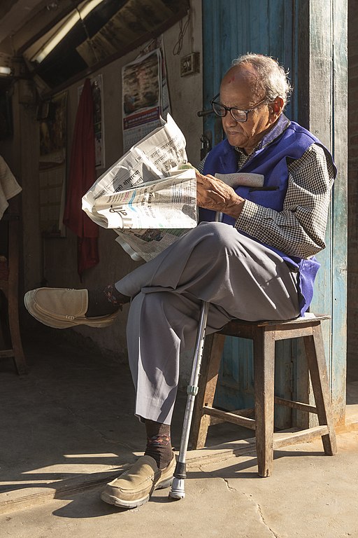 Old man reading news paper early_in the morning at Basantapur

This file is licensed under the Creative Commons Attribution-Share Alike 3.0 Unported license. 